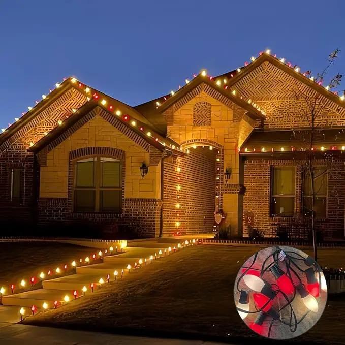 Red and white C9 Christmas lights along a home roofline and walkway